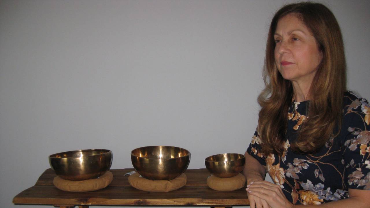 Sound healer with Tibetan Bowls