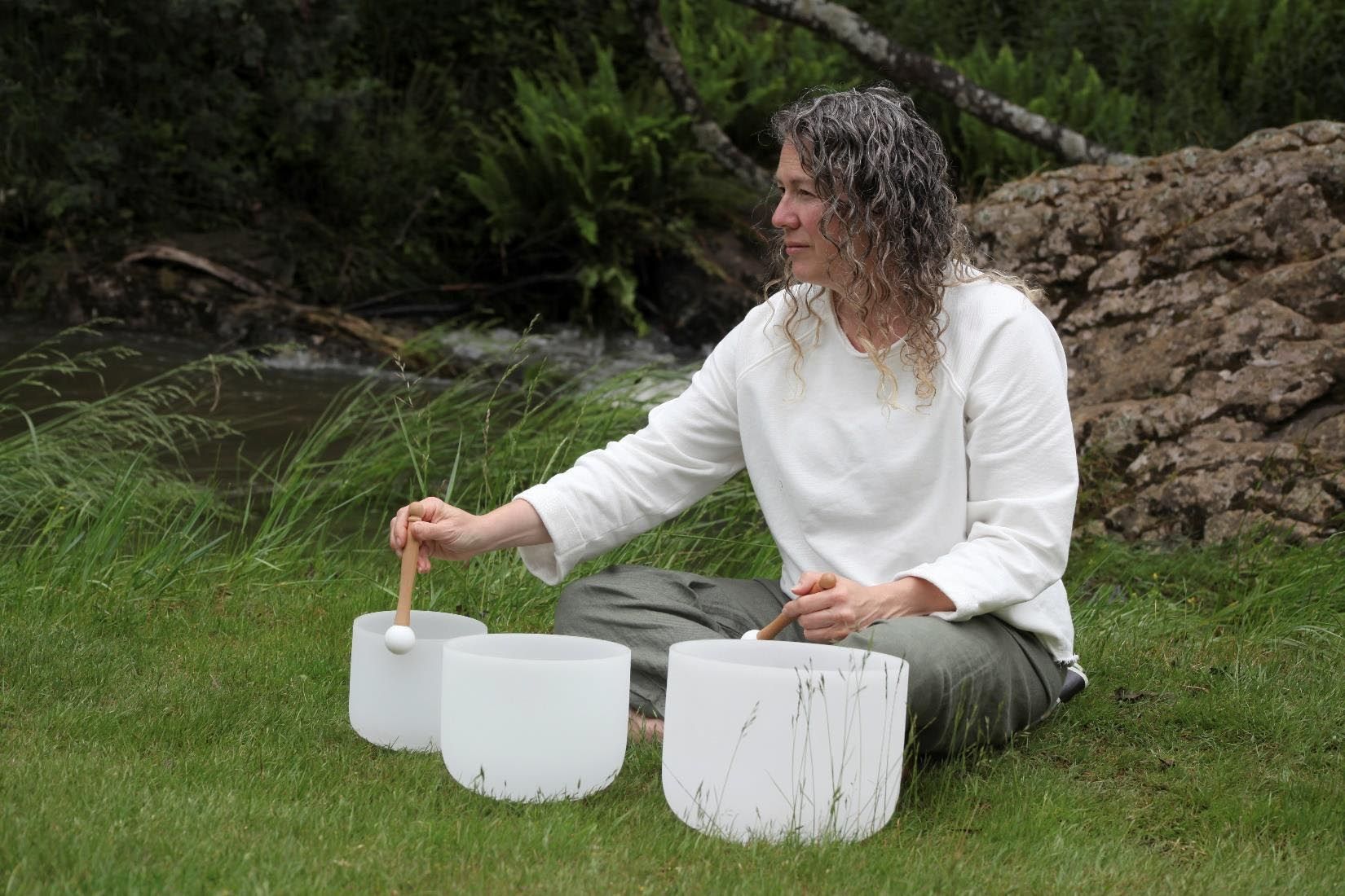 Sound Healing Practitioner playing Crystal Bowls