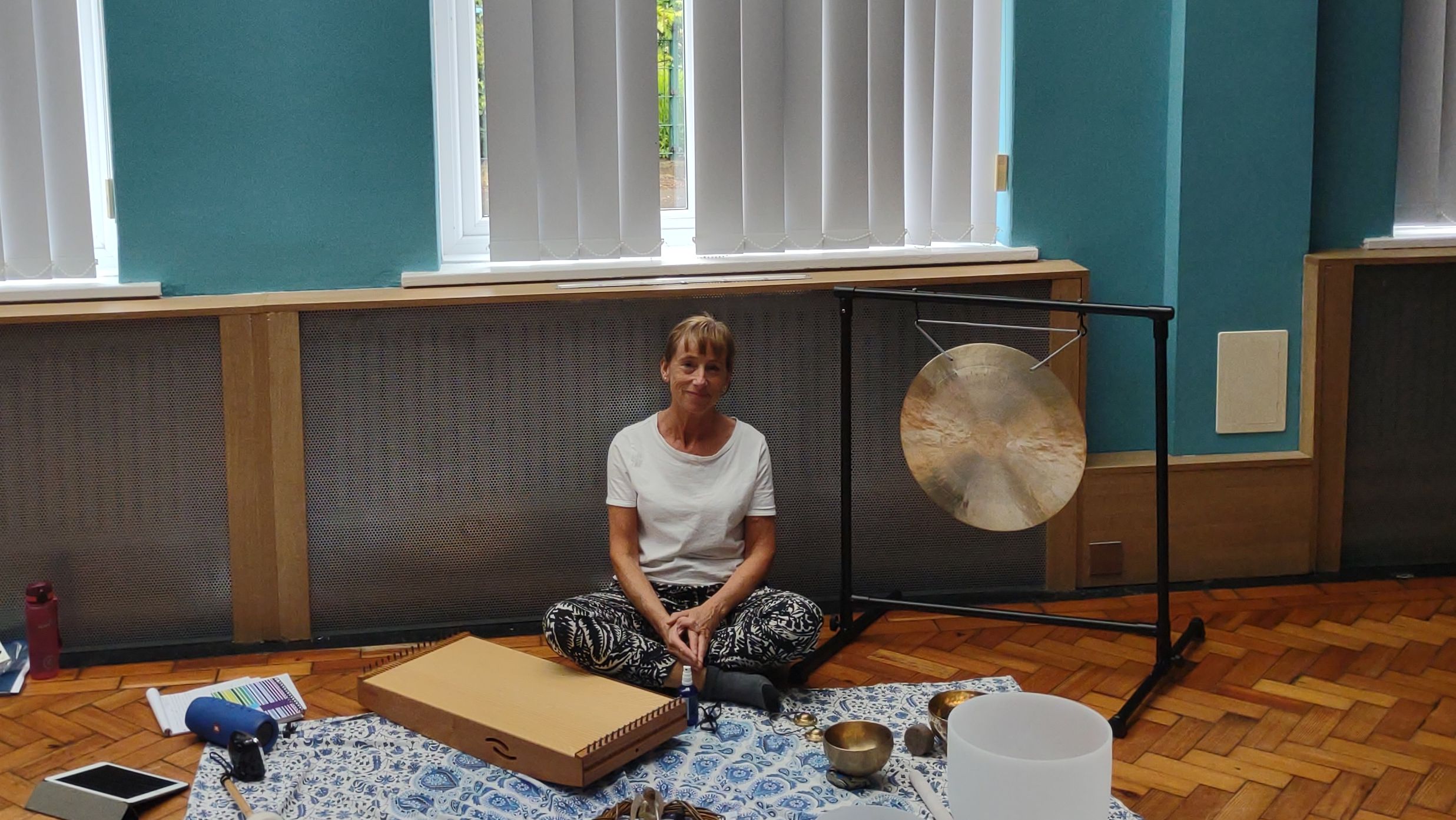 Woman in a white teacher with Sound Healing Instruments