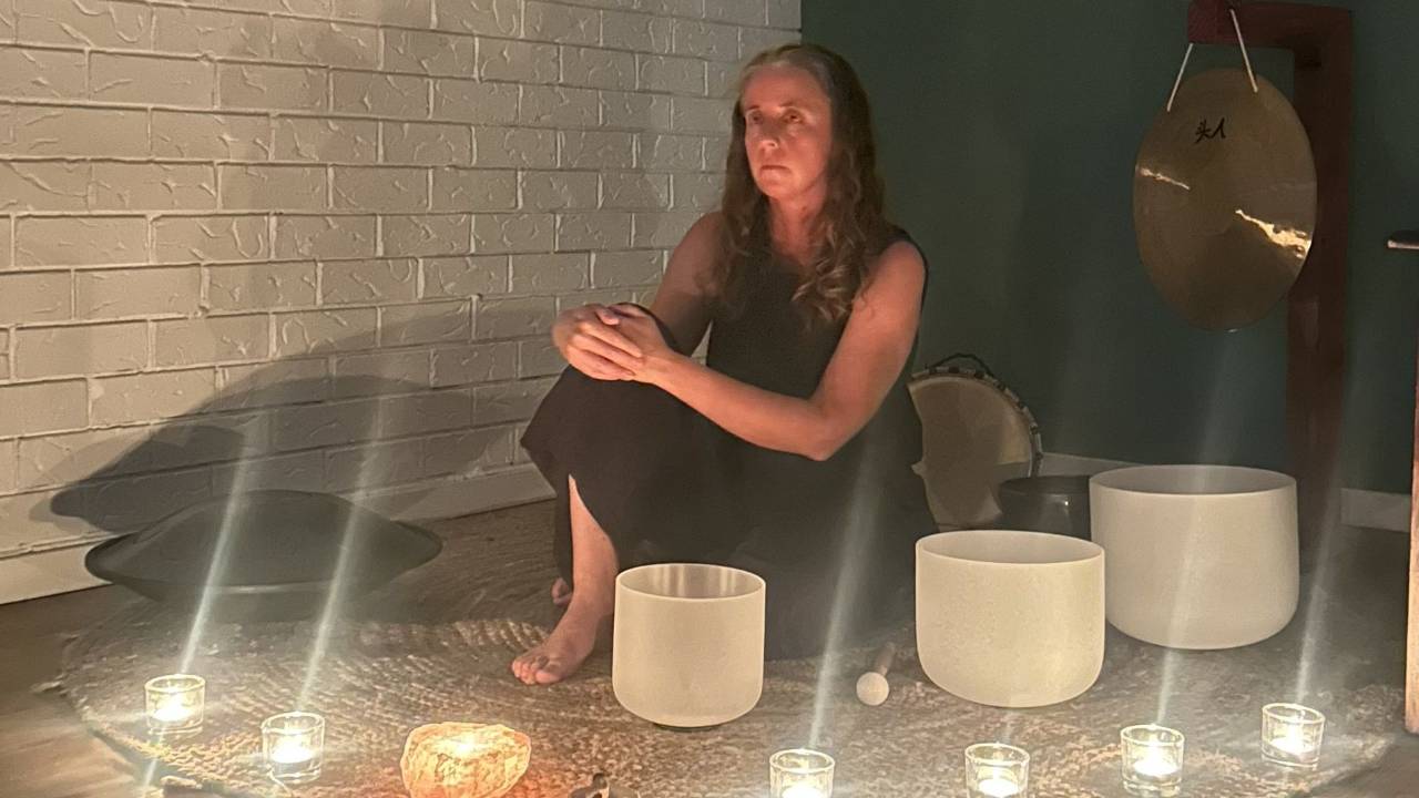 Woman with Crystal Singing Bowls
