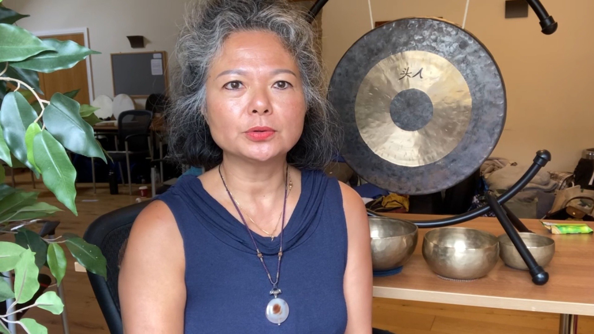 Woman giving a sound healing academy review for the Level 1 foundations of integral sound healing certified workshop course
