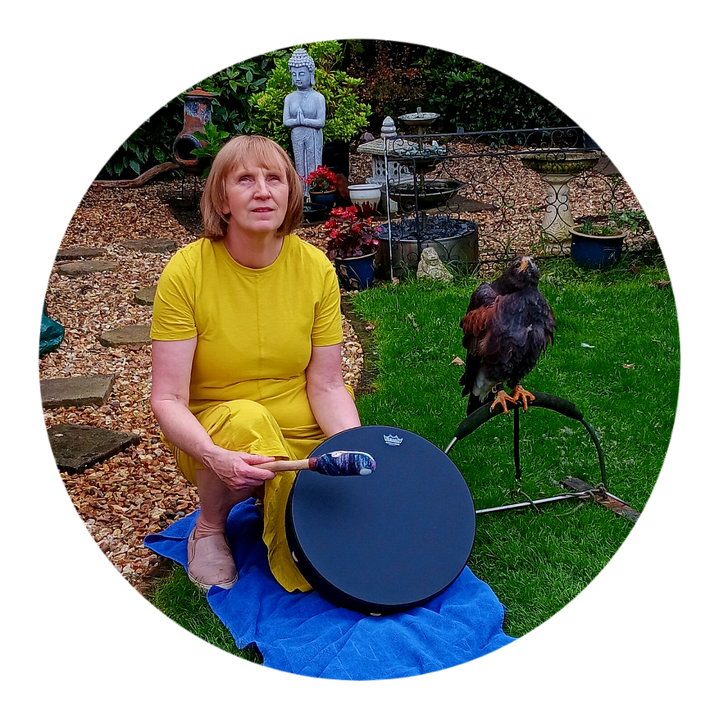Sound healing practitioner playing a drum